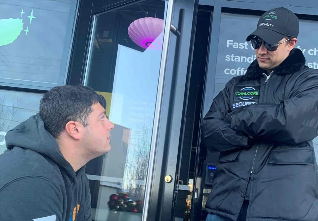 Replace with a photo of a Dahlcore hotel security officer in a lobby