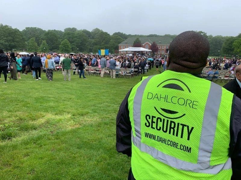 Replace with a photo of a Dahlcore guard at a turnstile or checkpoint